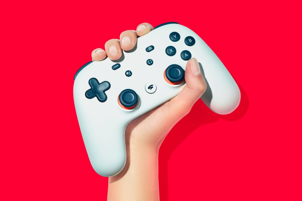 Hand Holding a Stadia Controller
