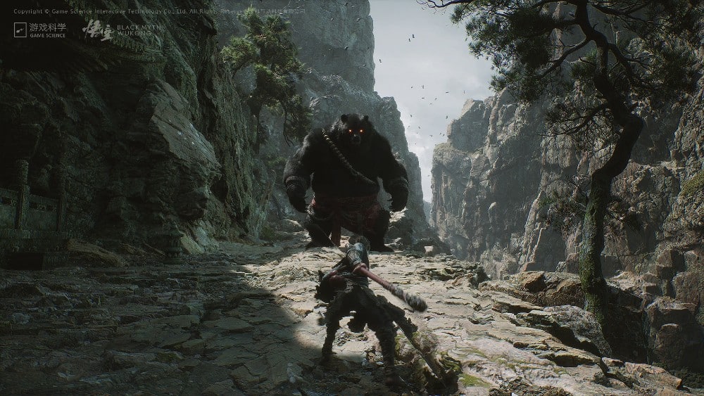 A warrior engages in battle with a large beast on a rocky mountain path surrounded by cliffs and trees, evoking scenes straight out of Black Myth: Wukong.