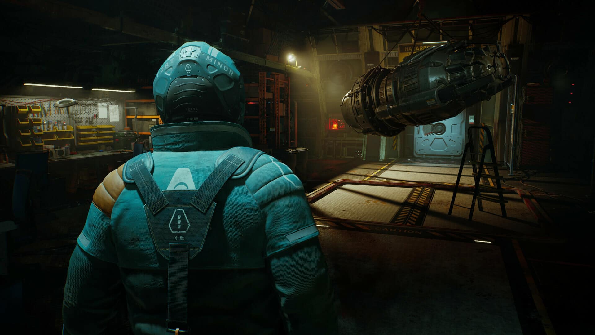 A person in a futuristic spacesuit stands in a dimly lit workshop on Fort Solis, surrounded by various tools and a large suspended cylindrical object.