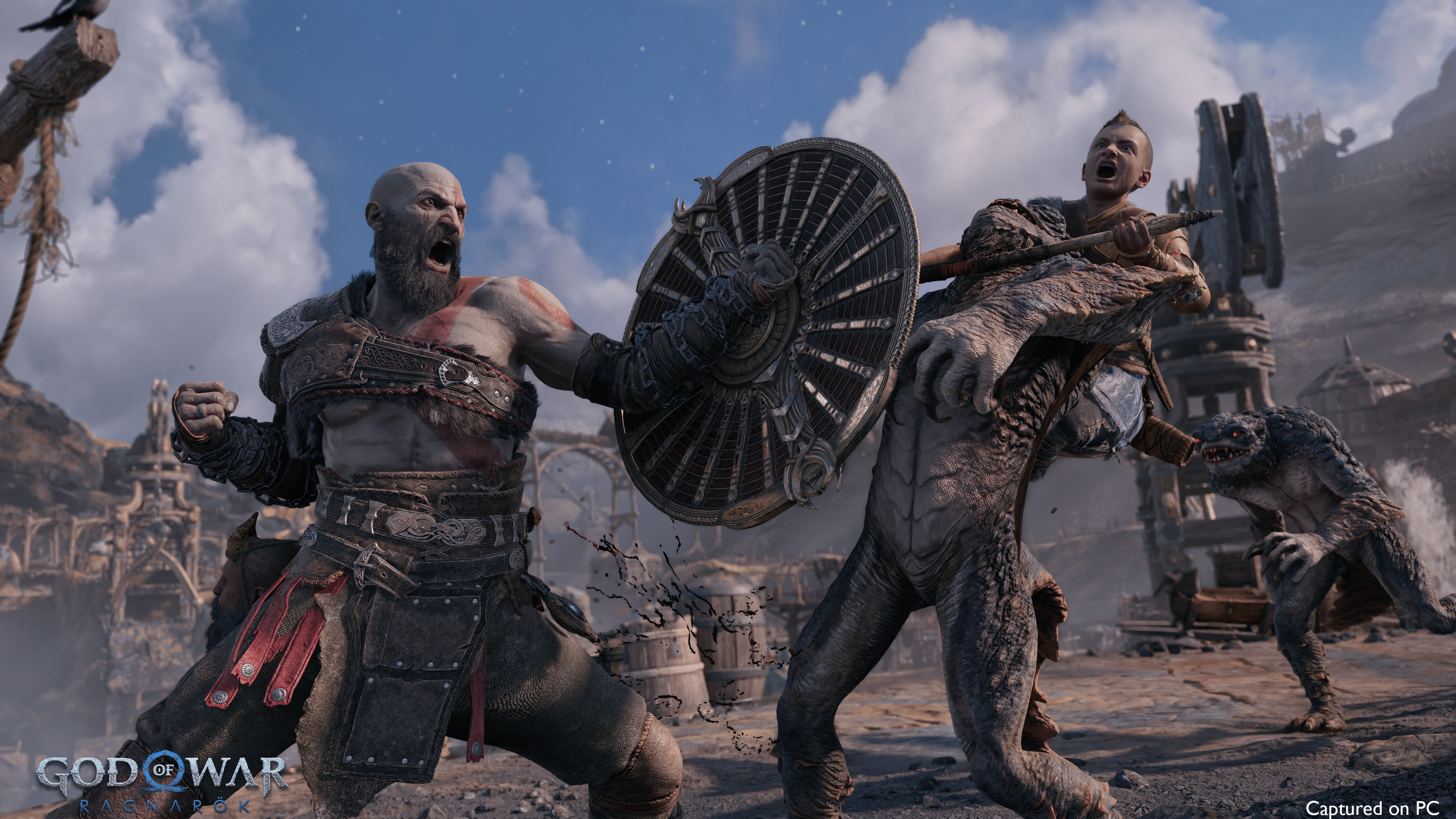 Kratos brandishes a shield and axe with his son Atreus while battling a creature in a rugged, snowy landscape, in God of War Ragnarök.