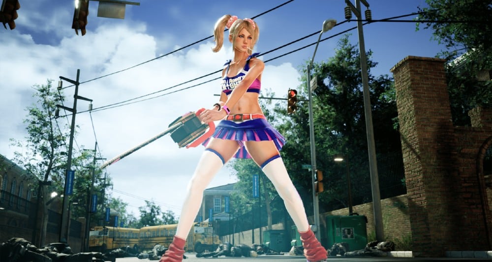 Juliet from Lollipop Chainsaw RePOP, holds a chainsaw on a city street, with zombies and debris in the background.