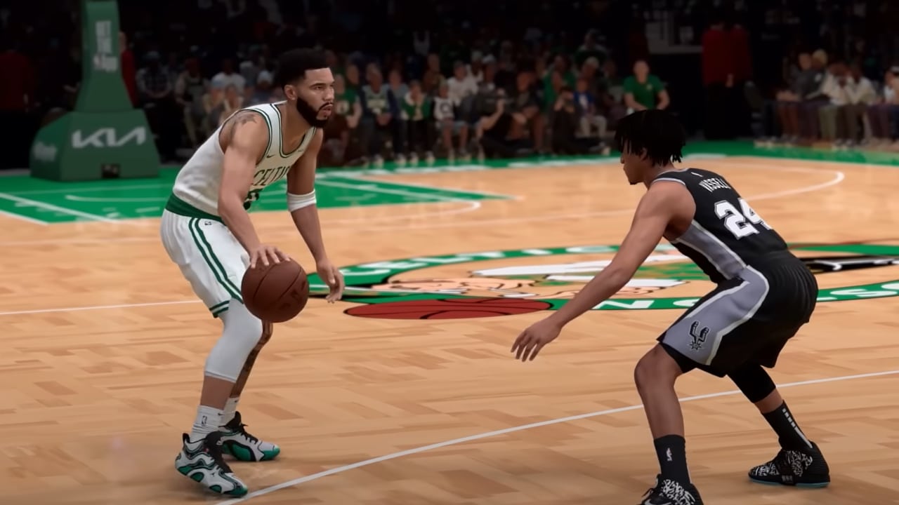 Two basketball players face off in a thrilling moment: the player in white skillfully dribbles while the player in black tenaciously defends on the wooden court, reminiscent of an intense match in NBA 2K25.