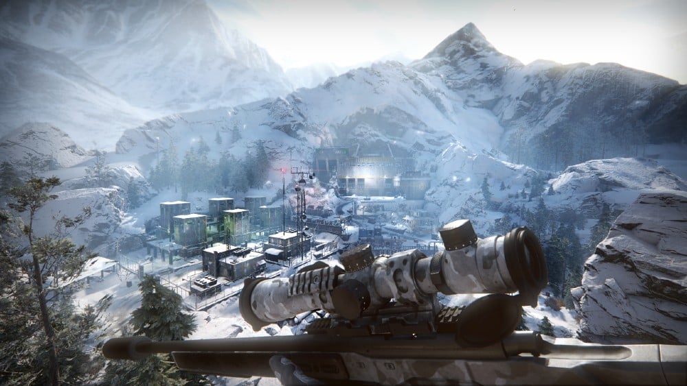 A sniper rifle overlooks a snowy mountain village with a complex of buildings nestled in the valley below, evoking the intense stealth and precision seen in Sniper Ghost Warrior Contracts.