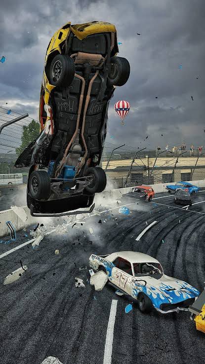 Wreckfest Marketing Image - Cars crashing on a racetrack with one car airborne and debris flying around, set against a cloudy sky with a hot air balloon.