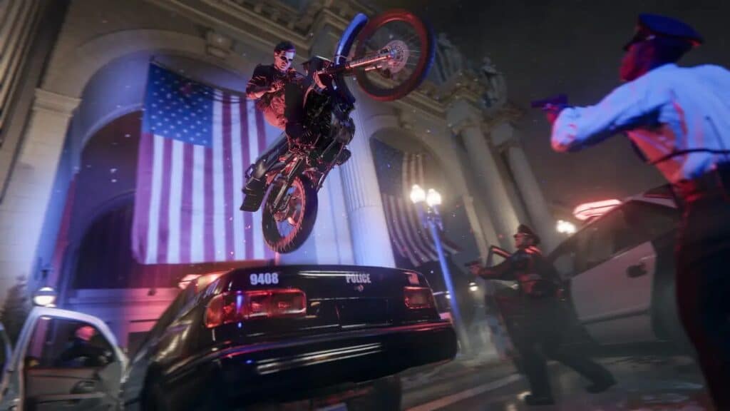 In a scene from Call of Duty: Black Ops 6, a daring motorcyclist leaps over a police car in front of a building adorned with American flags, while surprised officers on the ground watch in astonishment.