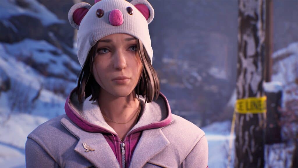 Amidst a snowy landscape, Max Caulfield wearing a bear-themed hat stands with caution tape fluttering in the backdrop, evoking an aura reminiscent of Life is Strange: Double Exposure.