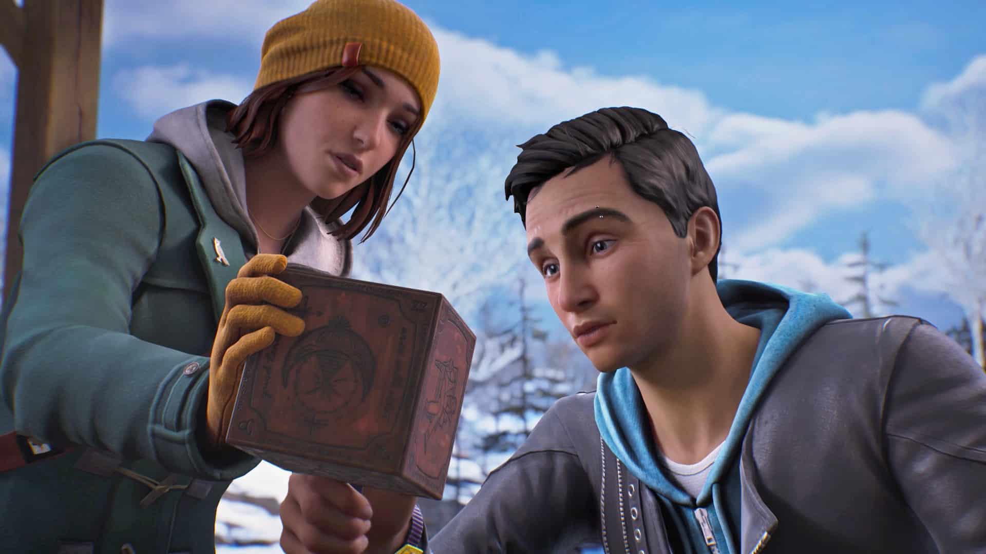 In a snowy landscape, two people intently examine a wooden box adorned with mysterious symbols, reminiscent of the intrigue found in Life is Strange: Double Exposure.