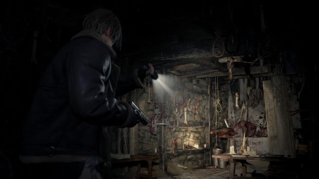 A survivor channels their inner Resident Evil 4 protagonist, gripping a flashlight and gun, while bravely navigating a dark, cluttered room filled with hanging objects and shadowy stone walls.