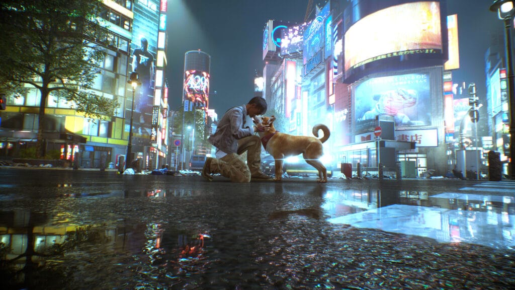 Amidst the bustling cityscape, neon lights reflect off the wet street as a person kneels to pet a dog, a scene from Ghostwire: Tokyo.