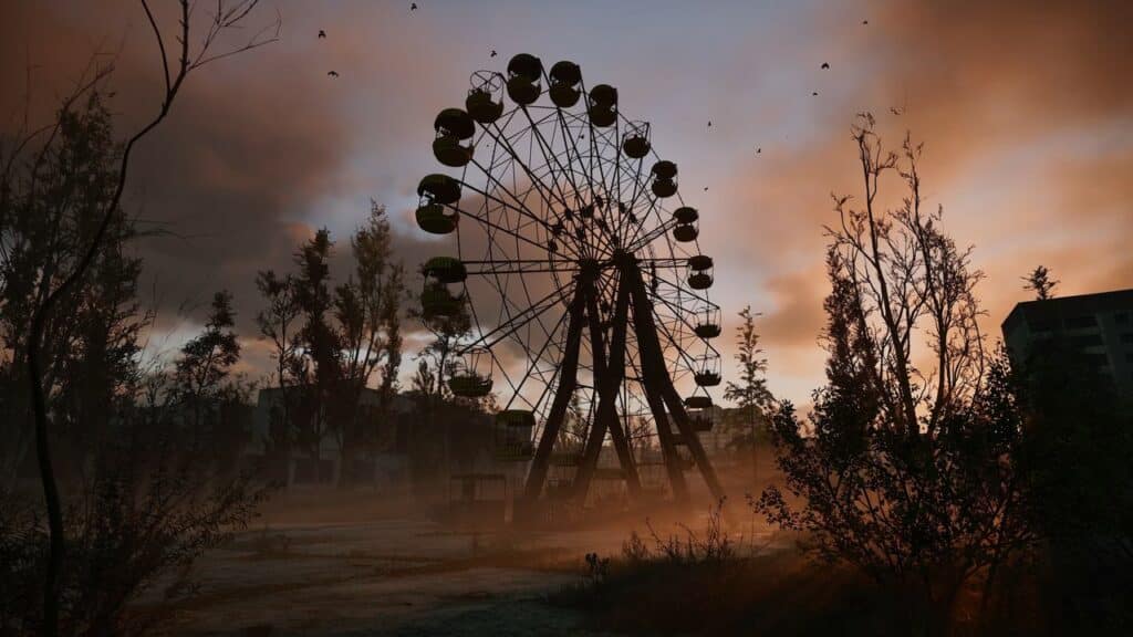 A silhouetted Ferris wheel against a dramatic sunset sky evokes the haunting beauty of STALKER 2: Heart of Chornobyl, with trees swaying and birds in flight adding to the surreal landscape.