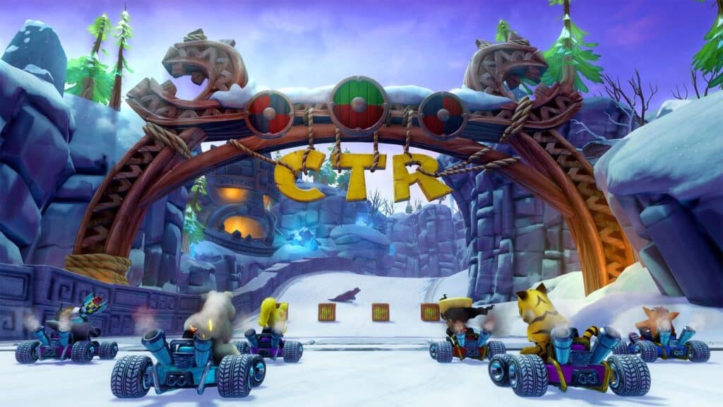 In Crash Team Racing Nitro-Fueled, characters in karts race on a snowy track under a wooden archway labeled "CTR," immersing players in a festive winter-themed setting.