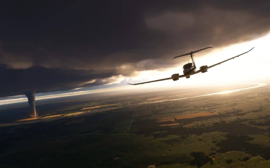 In Microsoft Flight Simulator 2024, a small plane daringly navigates near a tornado, soaring under dark clouds that cast ominous shadows over the sprawling landscape of fields and winding river below.