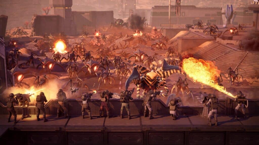 In a scene reminiscent of Starship Troopers: Extermination, soldiers on a barricade fiercely battle a horde of attacking alien creatures, using guns and flamethrowers amid the harsh desert landscape.