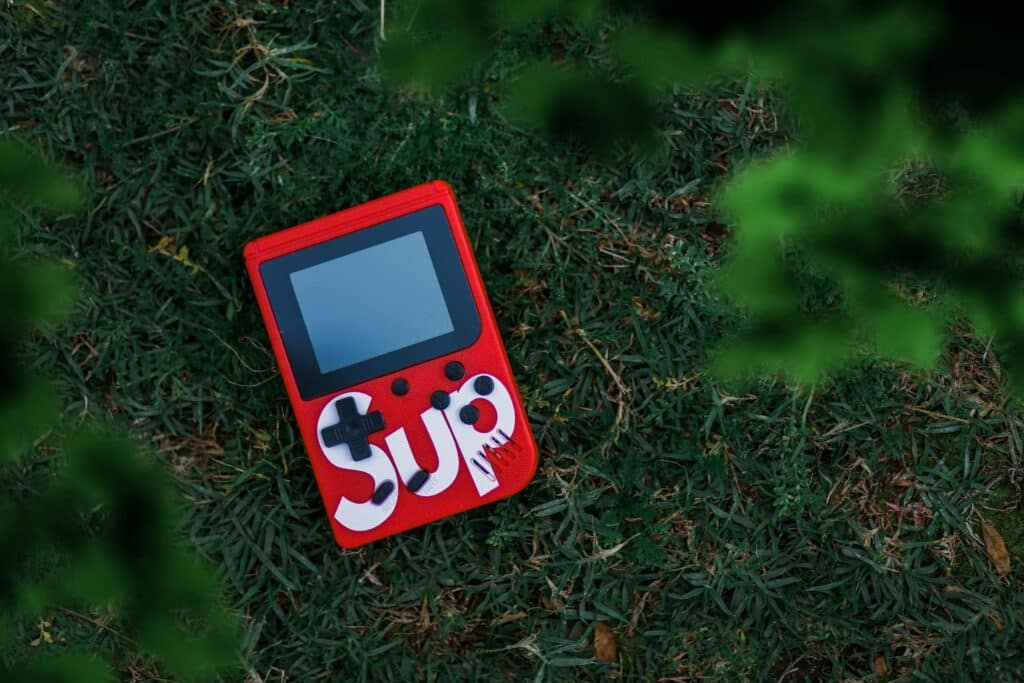 Nintendo DS lying in the grass