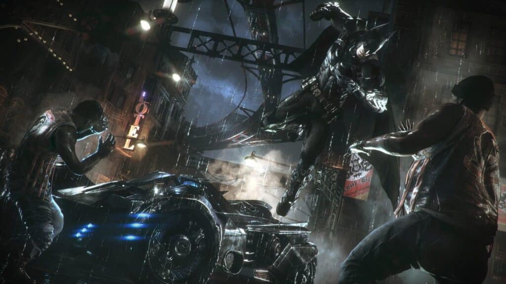 In a scene reminiscent of a Batman: Arkham Knight review, Batman leaps onto thugs in a rain-soaked street, the iconic Batmobile gleaming nearby under neon signs' glow.