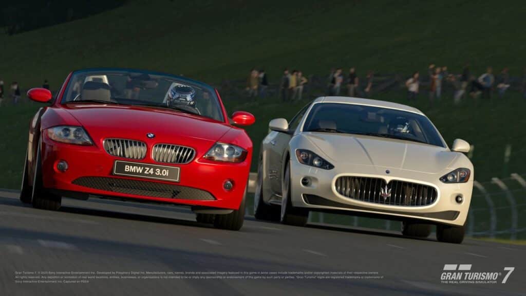 A red BMW Z4 and a white Maserati race side by side on the track, their engines roaring in harmony with Gran Turismo 7 update 1.56, against a backdrop of blurred greenery.