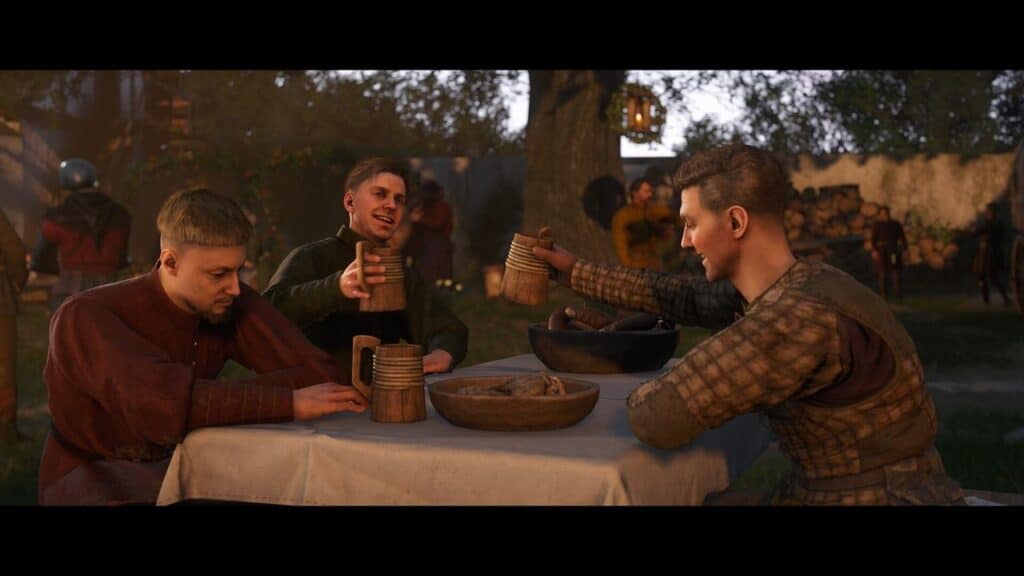 Three men sitting at a table outdoors, holding mugs and laughing heartily, with food in bowls and people in the background, as if sharing tales from a Kingdom Come: Deliverance II review.