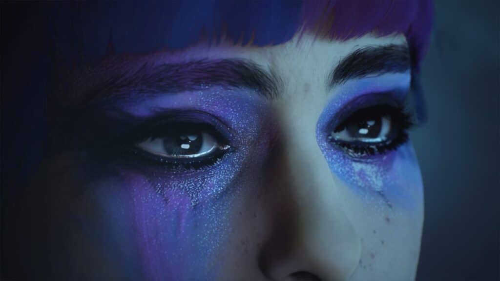 A close-up of a person's eyes reveals dramatic purple and blue makeup, their tears creating a shimmering effect reminiscent of the cover art for Lost Records: Bloom & Rage.