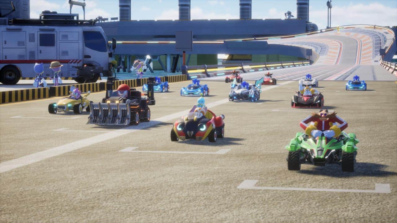 In this Sonic Racing: CrossWorlds preview, characters in colorful karts race on a broad track with a bridge gracefully arching in the background.