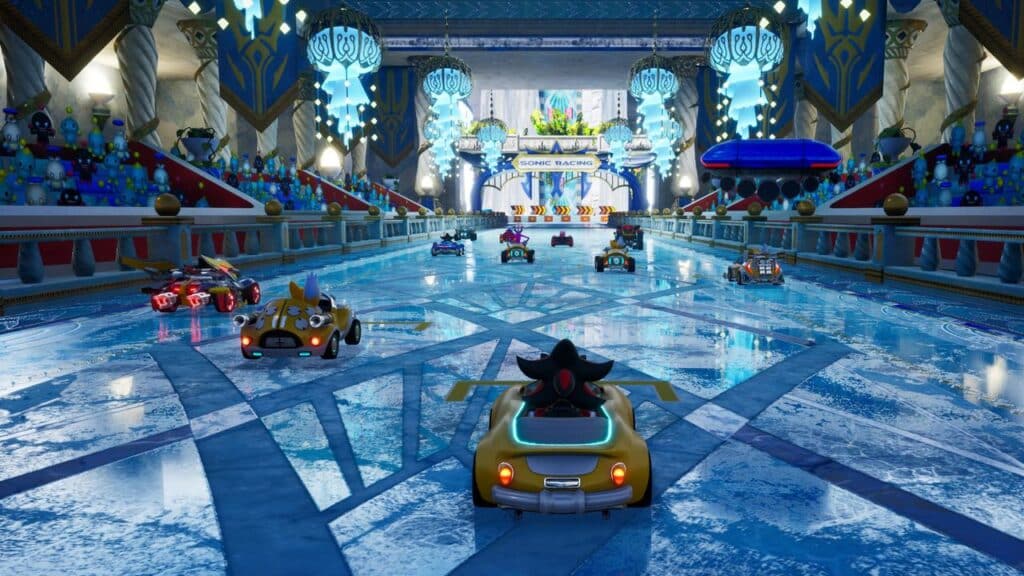 In a vibrant ice racing track, colorful karts and racers dash around a grand, decorated arena packed with spectators, offering an exhilarating glimpse of what's to come in the Sonic Racing: CrossWorlds preview.