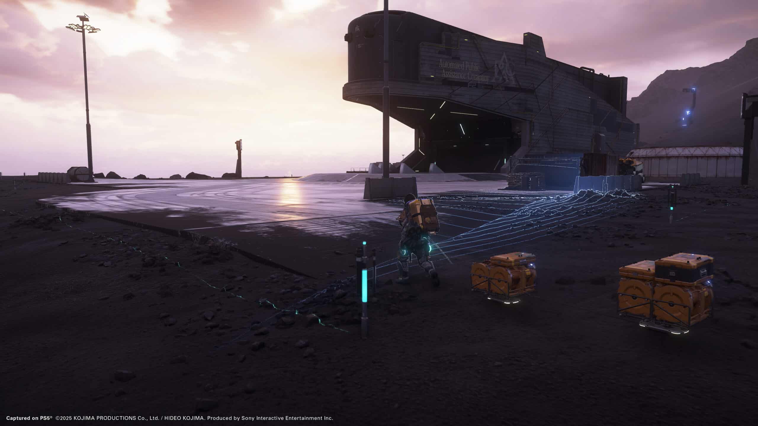 In a futuristic scene reminiscent of early Death Stranding 2 teasers, a figure carefully connects crates near a looming spaceship on the eerie, barren landscape. The first light of sunrise casts long shadows, hinting at untold adventures ahead.