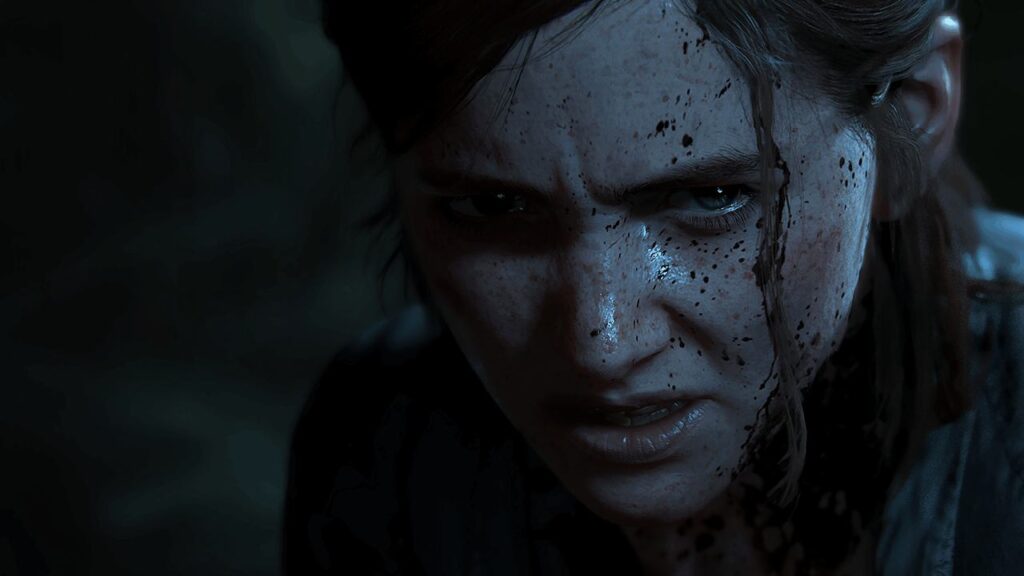 A female protagonist in a video game stands with a serious, intense expression, blood splatters across her face, all set against a shadowy backdrop.