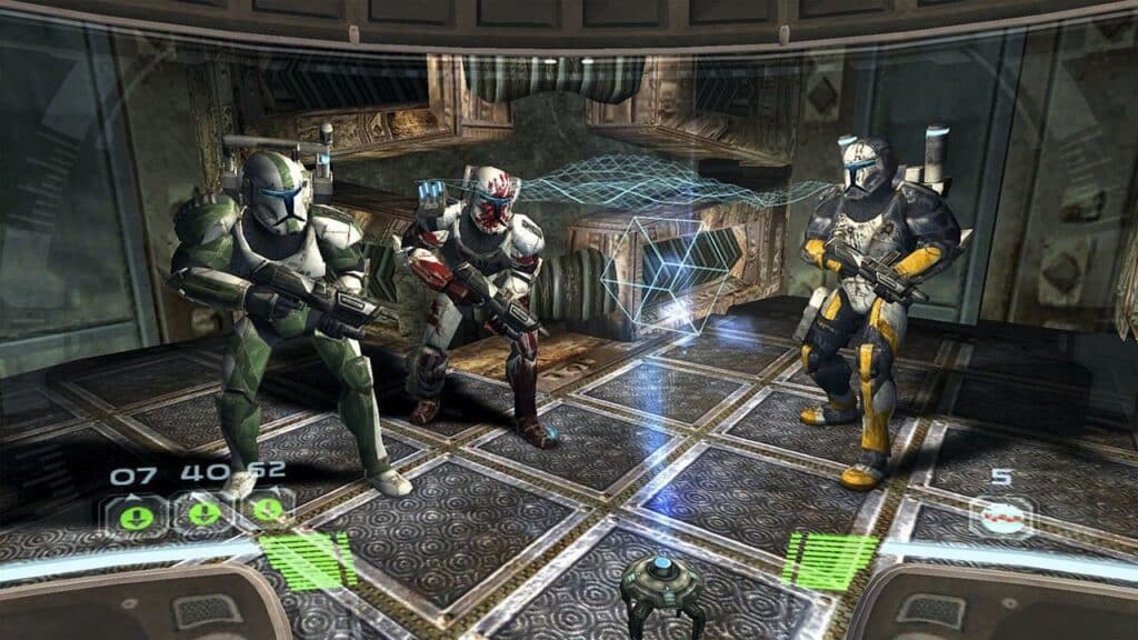 Three armored soldiers with weapons stand in a sci-fi room with holographic displays and metallic walls, ready for action—just like a scene from the best Star Wars games to play on May the 4th.