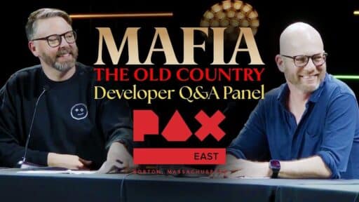 Two men sit at a panel table with "MAFIA THE OLD COUNTRY Developer Q&A Panel PAX East" above them during the Mafia: The Old Country PAX East panel.
