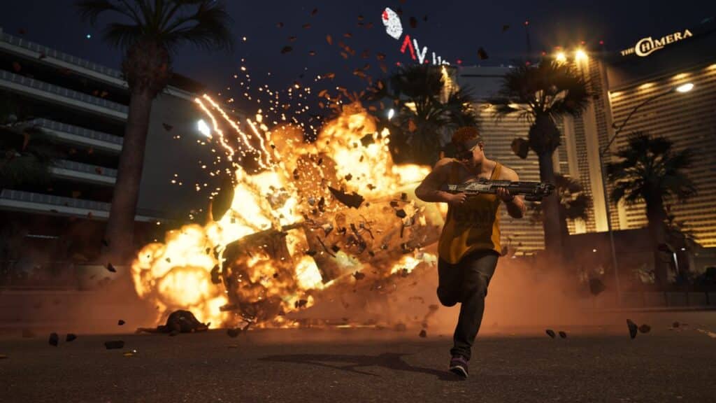 A person with a gun runs from a huge explosion and burning car on a city street at night, as if straight out of a MindsEye action sequence.