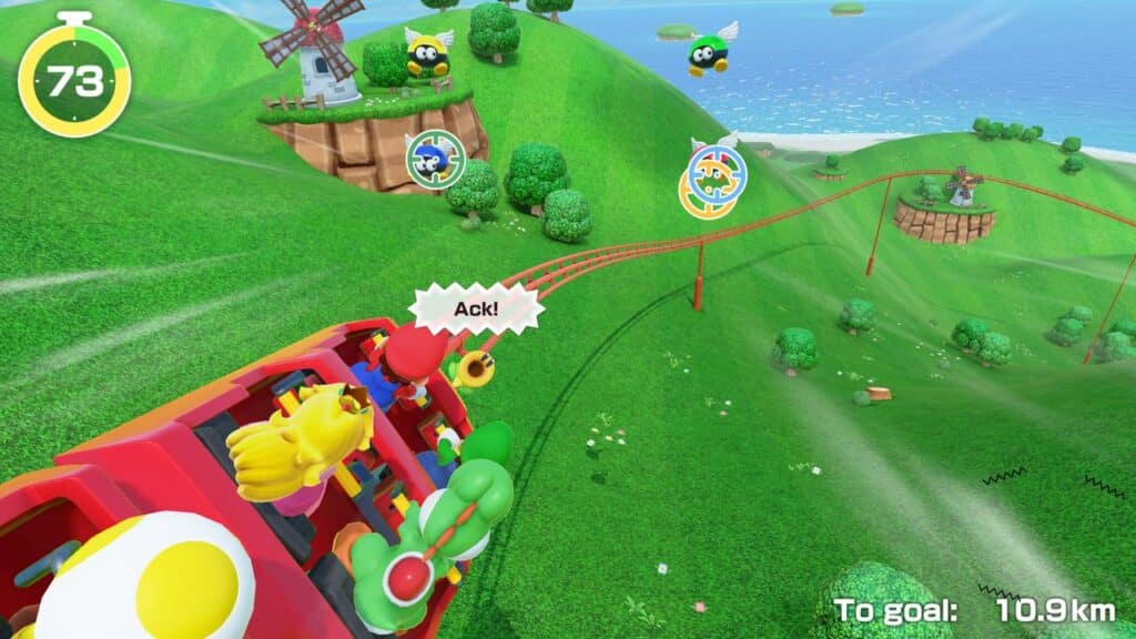 Mario characters ride a rollercoaster through green hills with bees, targets, and a seaside view in Super Mario Party Jamboree for Nintendo Switch 2.