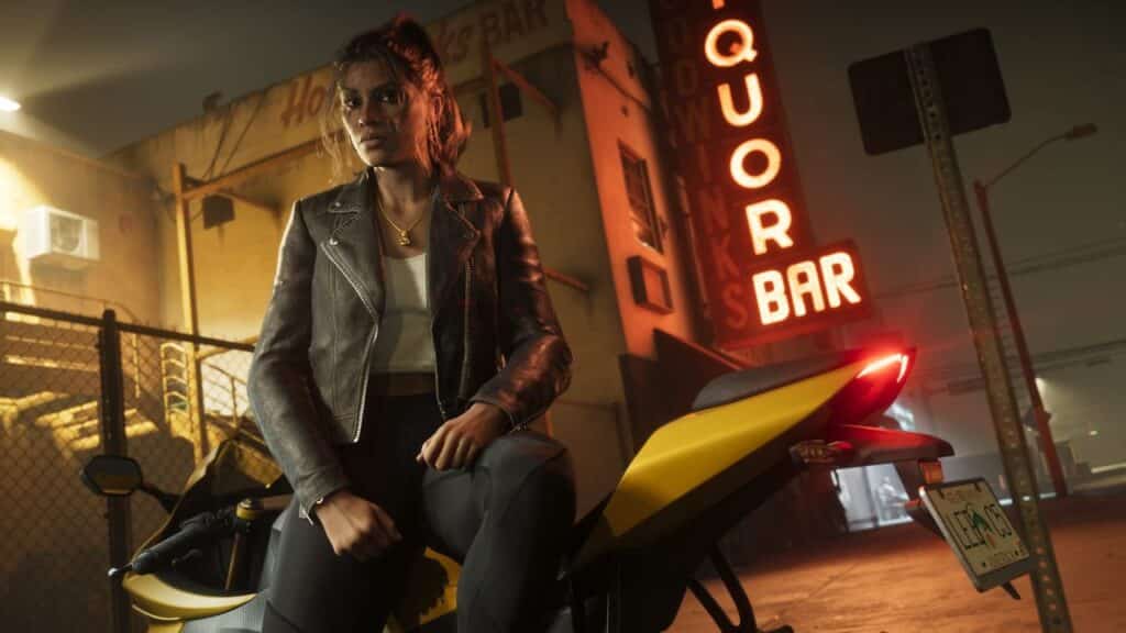A woman in a leather jacket sits on a yellow motorcycle at night near a neon-lit liquor bar, echoing the vibrant nightlife teased in the second GTA VI trailer.