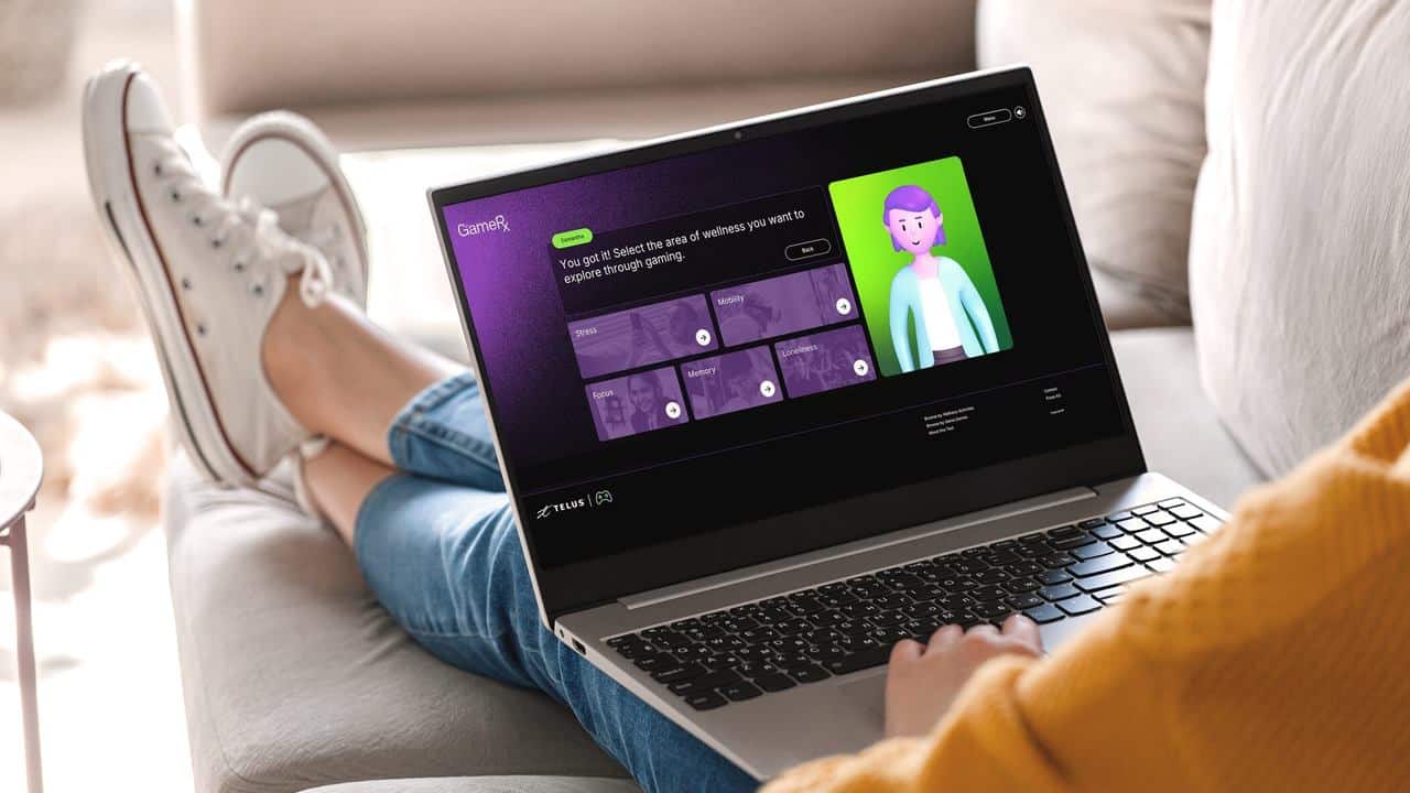 Person sitting on a couch using a laptop with an animated online learning module from the GameRx wellness gaming platform on the screen.