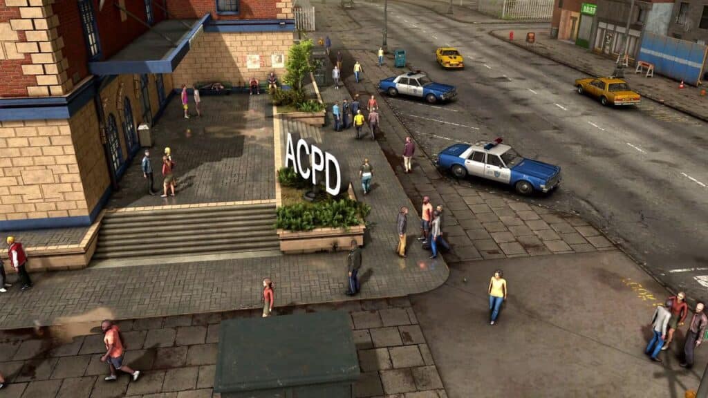 A city street scene outside The Precinct, with people walking and several parked police cars.
