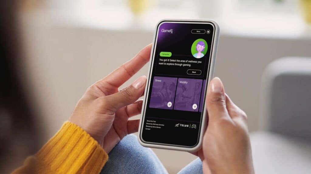 A person holding a smartphone displaying the GameRx wellness gaming platform, featuring engaging wellness app options on the screen.