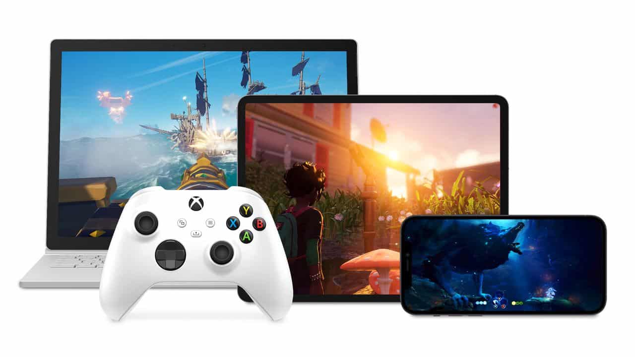 White Xbox controller in front of a laptop, tablet, and smartphone displaying different video games—a scene reflecting the digital ecosystem driving Xbox Q3 FY25 gaming revenue.
