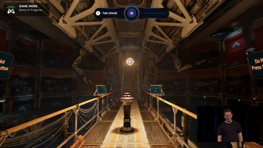 A sci-fi game scene inspired by the Fortnite State of Unreal 2025 event shows a control room with a central button; a man presents in the corner.