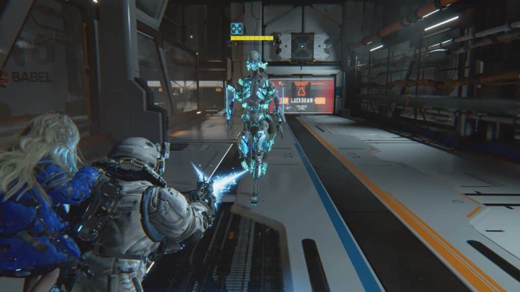 From Pragmata, two armored characters confront a glowing blue robot in a futuristic hallway with warning signs, hinting at action-packed moments from Capcom Spotlight June 2025.