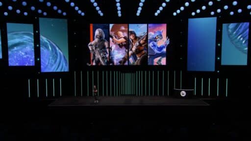 A presenter stands onstage beneath large gaming character images and the Unreal Engine logo at the Fortnite State of Unreal 2025 tech event.