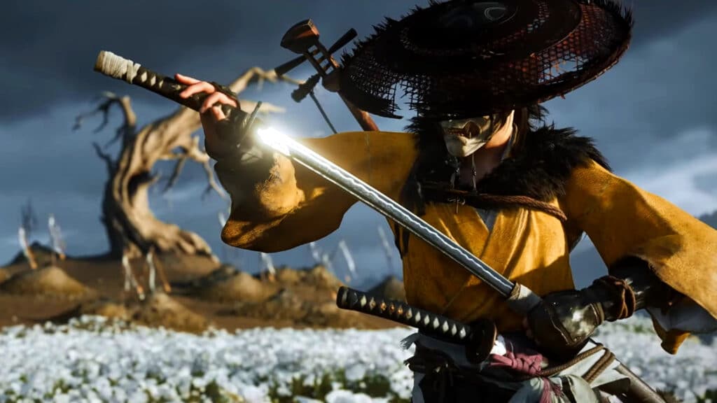 A samurai in a yellow robe unsheathes his sword in a field of white flowers with a twisted tree in the background—a scene reminiscent of visuals found in upcoming PS5 games.