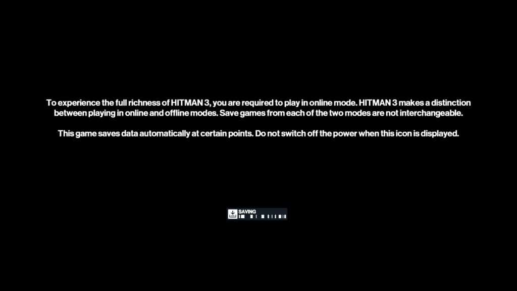 Black screen with white text explains online/offline modes in Hitman World of Assassination Signature Edition, and a saving progress bar appears at the bottom.