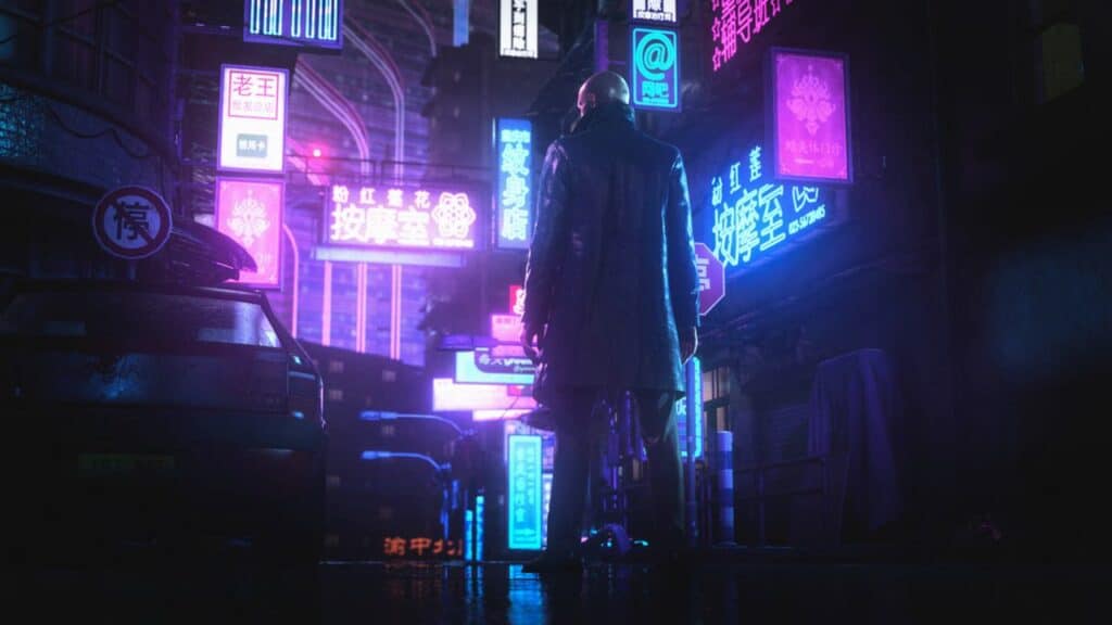 A person in a coat stands in a neon-lit city alley at night, surrounded by glowing signs in various languages, as if waiting for an IO Interactive interview.