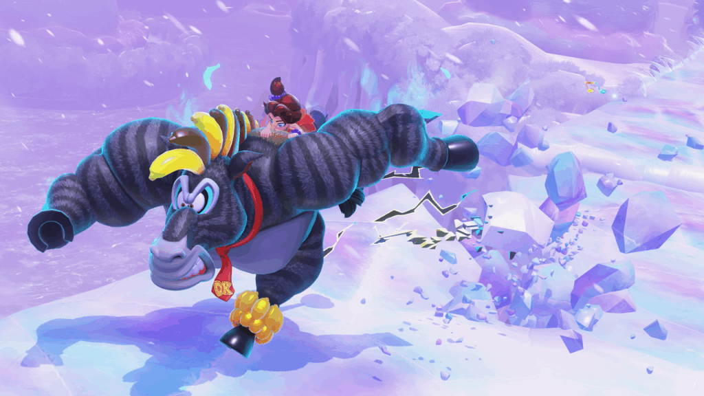 A muscular gorilla with a tie runs, smashing ice, while a girl rides on his back in a snowy, colorful landscape—an epic moment straight from the Donkey Kong Bananza Direct.