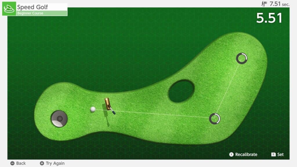 Top-down view of a mini-golf game with a ball, hole, and a curved green course on a grassy background, featured in the Nintendo Switch 2 Welcome Tour.