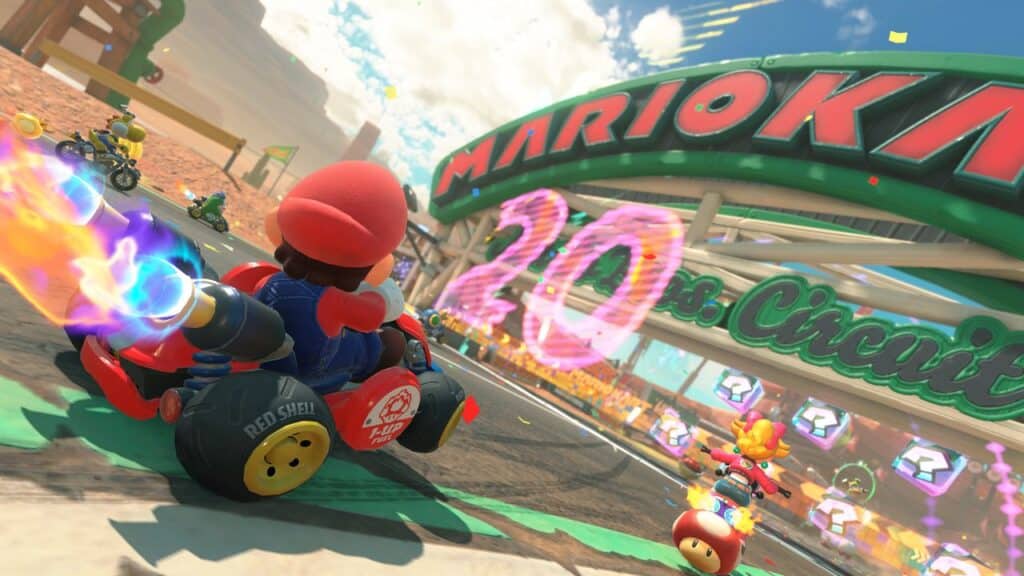 Mario drives a go-kart, boosting past others on a bright race track in a Mario Kart World scene played on the Nintendo Switch 2.