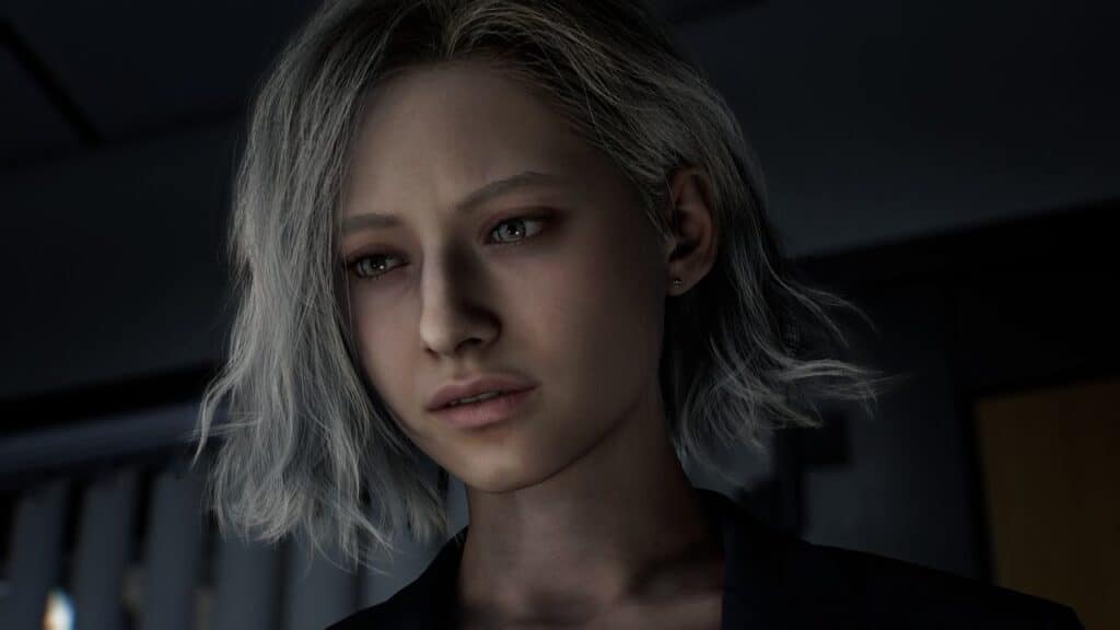 A woman with short, tousled blonde hair looks down with a serious expression in dim lighting, capturing the intense mood reminiscent of Resident Evil Requiem early impressions.