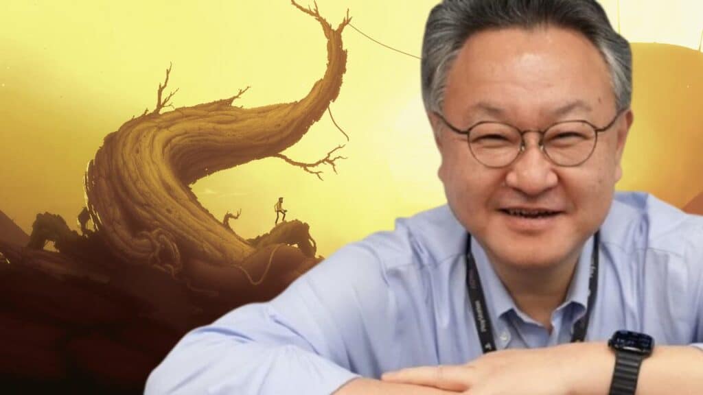 Smiling man with glasses stands in front of a surreal, twisted tree against a yellow sky, reminiscent of scenes discussed when Shuhei Yoshida talks Nintendo.