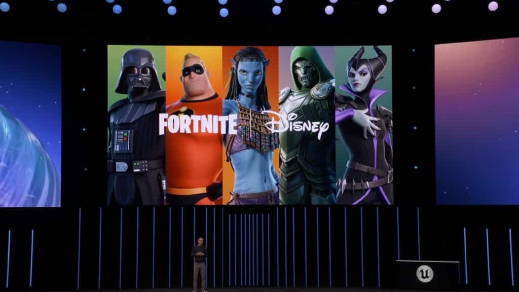 A presenter stands before a screen displaying Fortnite State of Unreal 2025 alongside Disney characters and their logos.
