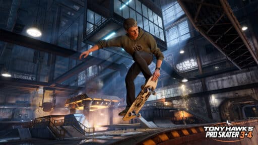 A skateboarder performs a trick in an industrial indoor skate park in Tony Hawk's Pro Skater 3+4 game.