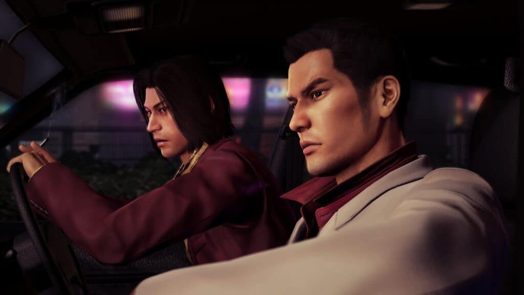 Two serious men sit in a car at night, one driving and holding a cigarette, both in suits—capturing the intense atmosphere of Yakuza 0: Director's Cut.