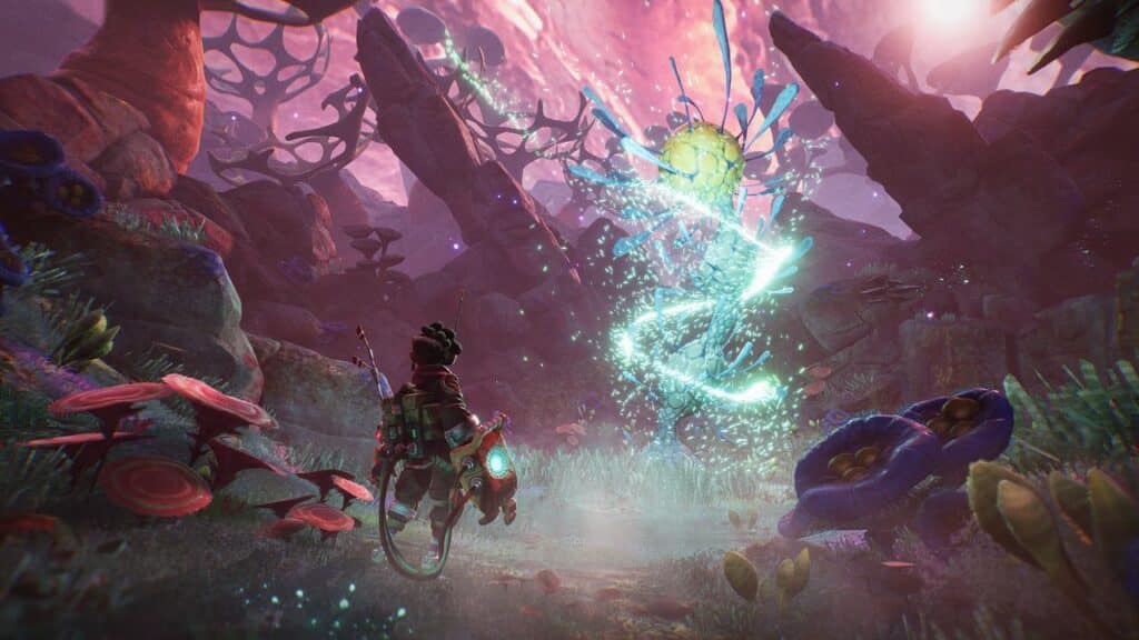 In a scene from The Gunk, a person in sci-fi gear faces glowing, magical energy in a colorful, alien landscape with strange plants—like a scene from the future where Atari could acquire Thunderful and unlock extraordinary worlds.
